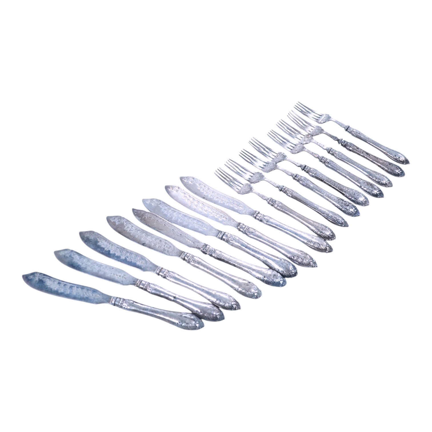 Eight Victorian silver fish forks and seven fish knives, by Hilliard & Thomason, Birmingham, 1878, with loaded unmarked white metal handles, one a plated replacement.